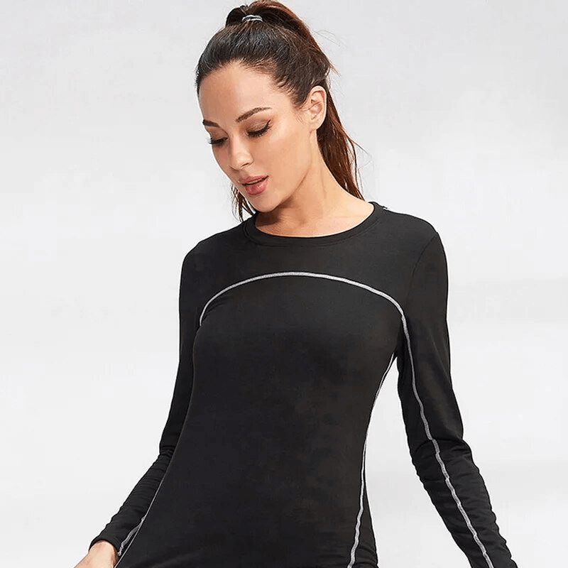 Woman wearing Warm Breathable Women's Sport Long Sleeve Top, perfect for yoga. Quick-dry, black, stylish design for activewear enthusiasts.
